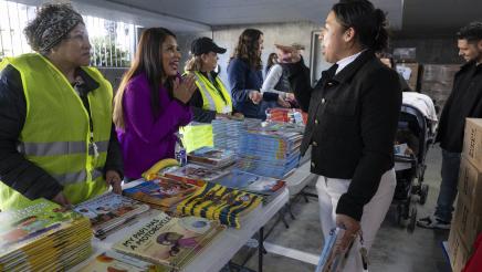 Asm. Ortega talking with parent at the event
